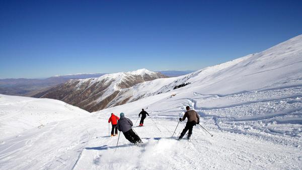 Four Skiers enjoying a power run at Mt Dobson
